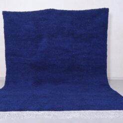 Moroccan royal blue Beni Ourain rug highlighting soft, thick wool pile and detailed hand-knotted Berber patterns in deep blue tone.