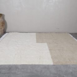 custom Moroccan Beni Ourain rug in ivory and taupe, featuring natural wool fibers and artisan finish.
