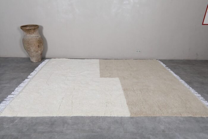 custom Moroccan Beni Ourain rug in ivory and taupe, featuring natural wool fibers and artisan finish.