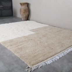 ivory and taupe Moroccan rug, illustrating handwoven tassels and authentic Berber details.