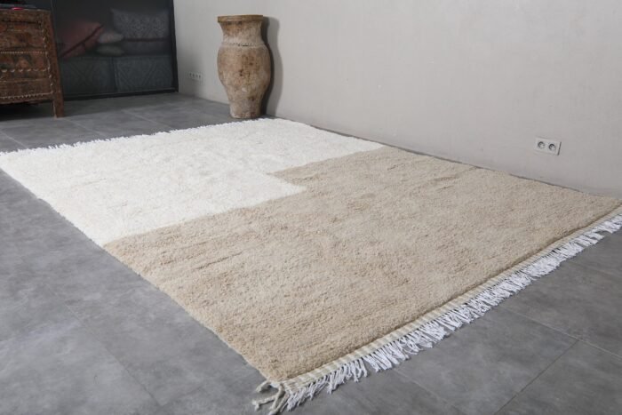 ivory and taupe Moroccan rug, illustrating handwoven tassels and authentic Berber details.