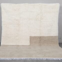 ivory and taupe wool Moroccan rug, highlighting the rug’s thickness, backing, and texture.