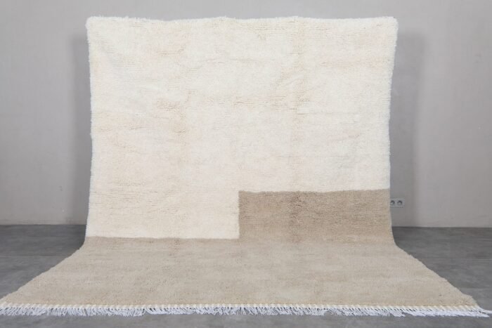 ivory and taupe wool Moroccan rug, highlighting the rug’s thickness, backing, and texture.