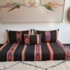 Handmade Moroccan wool floor sofa set in black and orange with blue embroidered stripes, unstuffed and zippered cushion covers