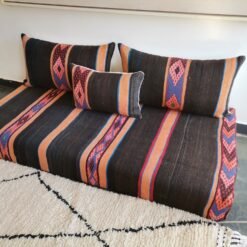 Unfilled Moroccan floor cushions with zippered covers laid out flat