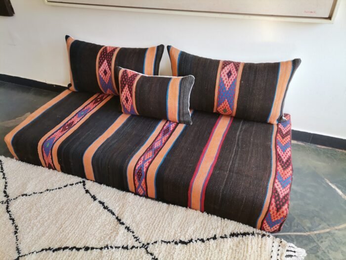 Unfilled Moroccan floor cushions with zippered covers laid out flat