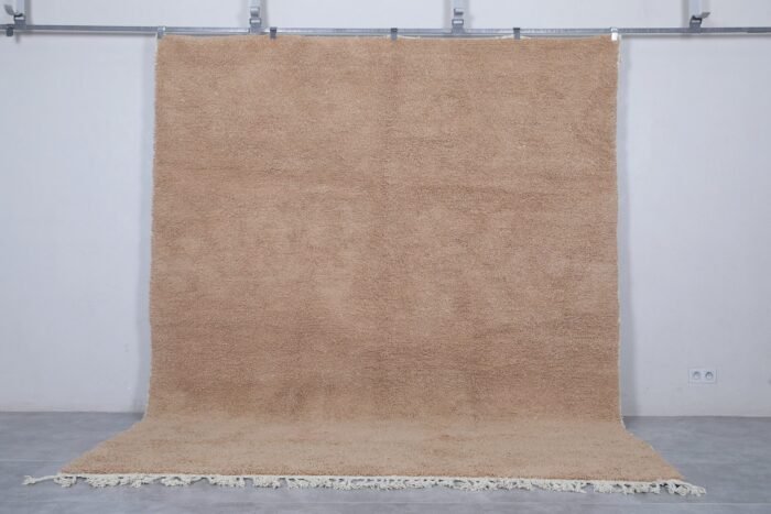custom Beni Ourain Moroccan rug in soft sand brown color, hand-knotted from natural lamb wool by Berber artisans in the Atlas Mountains.