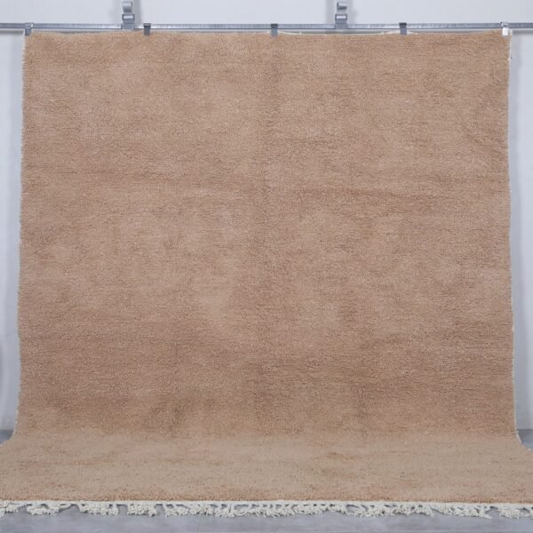 Authentic Moroccan sand brown Beni Ourain rug, handcrafted using 100% natural lamb wool. The soft earth-toned color blends beautifully with rustic, minimalist, and modern decor styles, perfect for living rooms or bedrooms.