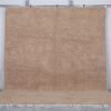 Authentic Moroccan sand brown Beni Ourain rug, handcrafted using 100% natural lamb wool. The soft earth-toned color blends beautifully with rustic, minimalist, and modern decor styles, perfect for living rooms or bedrooms.