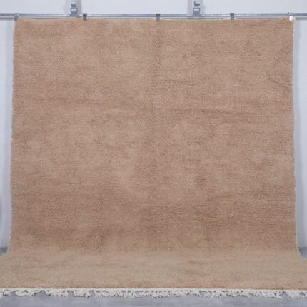 Authentic Moroccan sand brown Beni Ourain rug, handcrafted using 100% natural lamb wool. The soft earth-toned color blends beautifully with rustic, minimalist, and modern decor styles, perfect for living rooms or bedrooms.
