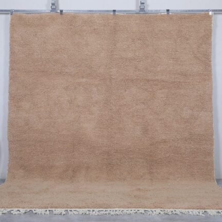 Authentic Moroccan sand brown Beni Ourain rug, handcrafted using 100% natural lamb wool. The soft earth-toned color blends beautifully with rustic, minimalist, and modern decor styles, perfect for living rooms or bedrooms.