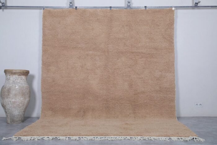Authentic Moroccan sand brown Beni Ourain rug, handcrafted using 100% natural lamb wool. The soft earth-toned color blends beautifully with rustic, minimalist, and modern decor styles, perfect for living rooms or bedrooms.
