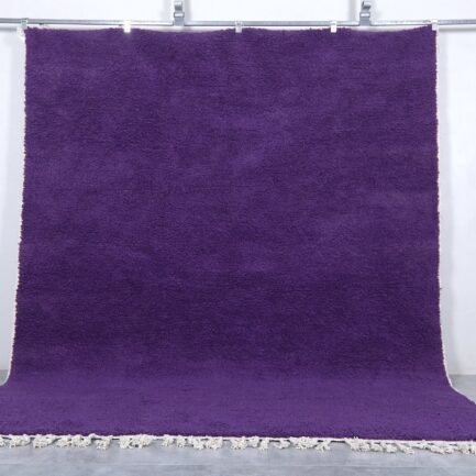 Handmade Moroccan royal purple wool rug with traditional Beni Ourain design.