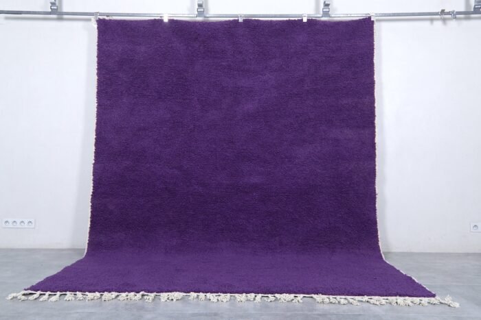 Handmade Moroccan royal purple wool rug with traditional Beni Ourain design.