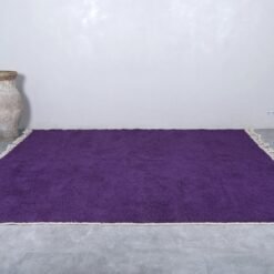 Moroccan royal purple Beni Ourain wool rug with soft texture.