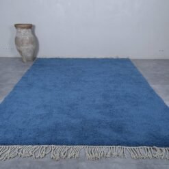 detail of a solid teal Beni Ourain rug, showing authentic hand-knotting and rich wool texture. A timeless rug for artistic and minimalist spaces