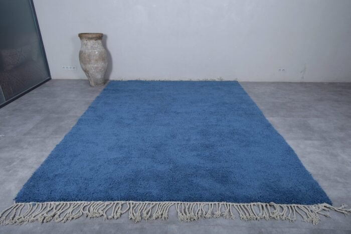 detail of a solid teal Beni Ourain rug, showing authentic hand-knotting and rich wool texture. A timeless rug for artistic and minimalist spaces
