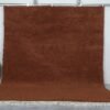 Handmade Moroccan dark brown wool rug with traditional Beni Ourain design and rich texture.