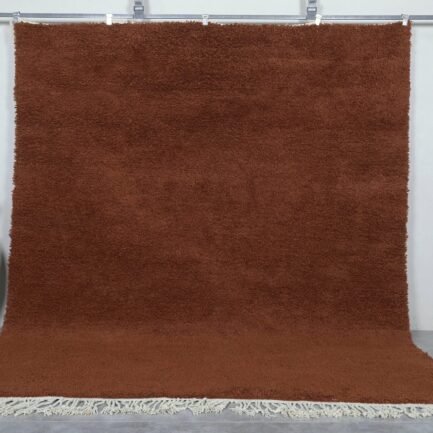 Handmade Moroccan dark brown wool rug with traditional Beni Ourain design and rich texture.