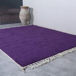 handmade Moroccan royal purple wool rug with plush texture.