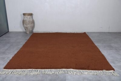 dark brown Moroccan wool rug, showcasing deep earthy tones and plush weave.