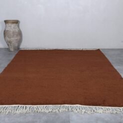 dark brown Moroccan wool rug, showcasing deep earthy tones and plush weave.