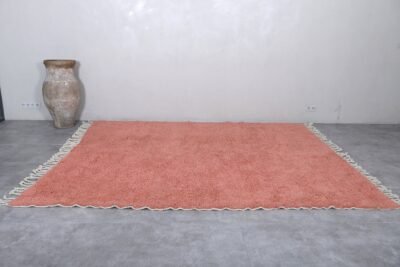 handmade blush pink Moroccan rug with plush wool surface.