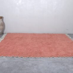 handmade blush pink Moroccan rug with plush wool surface.