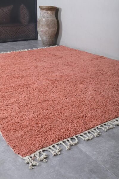 Fringe detail of Moroccan blush pink wool rug with artisanal Berber finish.