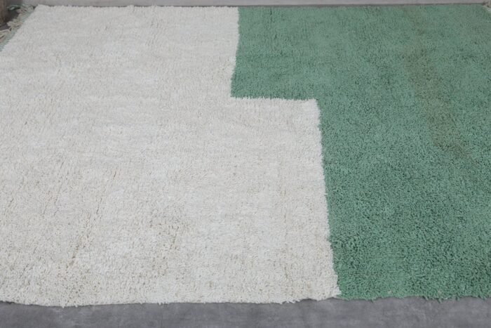hand-knotted Moroccan Beni Ourain rug in ivory and green, showing its density, thickness, and quality wool construction.
