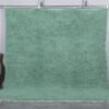 Handmade Moroccan Berber rug in mint green, crafted from 100% natural wool with a soft, minimalist design. This custom Beni Ourain rug blends traditional craftsmanship with a fresh modern color, perfect for boho interiors, cozy bedrooms, or calm living spaces.