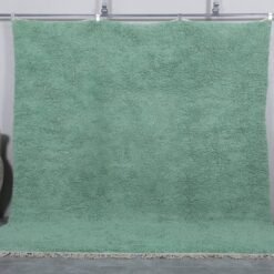 Handmade Moroccan Berber rug in mint green, crafted from 100% natural wool with a soft, minimalist design. This custom Beni Ourain rug blends traditional craftsmanship with a fresh modern color, perfect for boho interiors, cozy bedrooms, or calm living spaces.