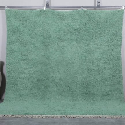 Handmade Moroccan Berber rug in mint green, crafted from 100% natural wool with a soft, minimalist design. This custom Beni Ourain rug blends traditional craftsmanship with a fresh modern color, perfect for boho interiors, cozy bedrooms, or calm living spaces.