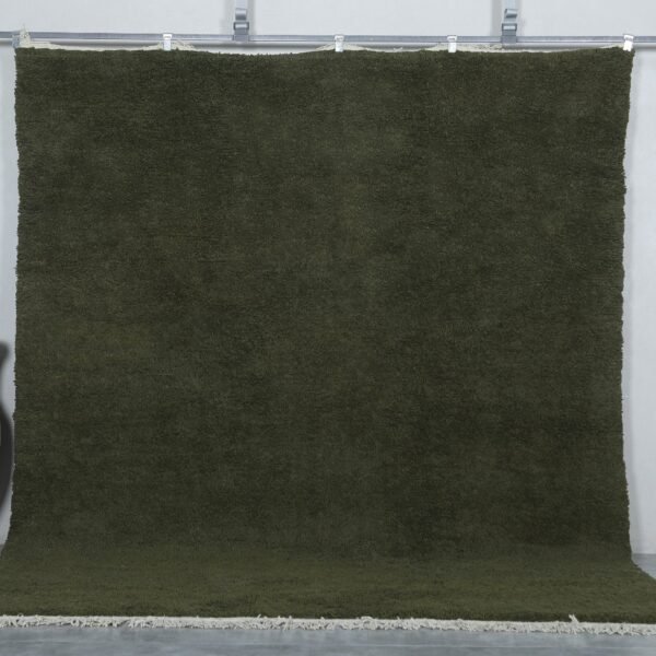 Handmade Moroccan Dark Green Berber Rug crafted from 100% natural wool, featuring a deep green solid color and traditional Beni Ourain weave—perfect for living rooms, bedrooms, or minimalist interiors