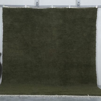 Handmade Moroccan Dark Green Berber Rug crafted from 100% natural wool, featuring a deep green solid color and traditional Beni Ourain weave—perfect for living rooms, bedrooms, or minimalist interiors