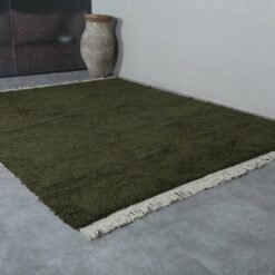 Dark Green Beni Ourain Rug, showcasing its rich wool texture, plush feel, and minimalist solid design ideal for contemporary Moroccan decor.