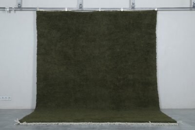 Moroccan Dark Green Wool Rug showing detailed hand-knotted texture, thick natural wool pile, and authentic Berber craftsmanship from the Atlas Mountains.