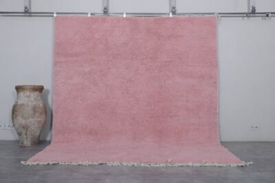 Authentic handmade Moroccan millennial pink rug, crafted from 100% natural wool using traditional Beni Ourain weaving. This soft and elegant solid pink area rug is perfect for modern interiors, bedrooms, or boho living rooms.