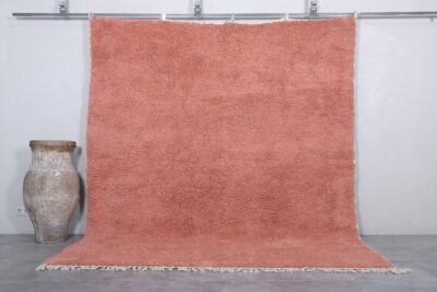 Handmade Moroccan blush pink wool rug with soft Beni Ourain texture.