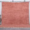 Handmade Moroccan blush pink wool rug with soft Beni Ourain texture.