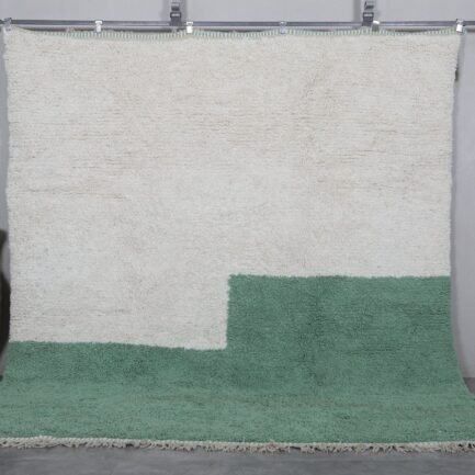 Handmade ivory and green Moroccan wool rug crafted by Berber artisans using 100% natural lamb wool, featuring traditional Beni Ourain design for a timeless, earthy aesthetic.