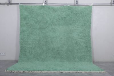 handmade mint green Moroccan rug, showing the fine wool texture and subtle color. Handwoven by Berber women, this rug adds calm and character to modern, minimalist, or Scandinavian-style rooms.