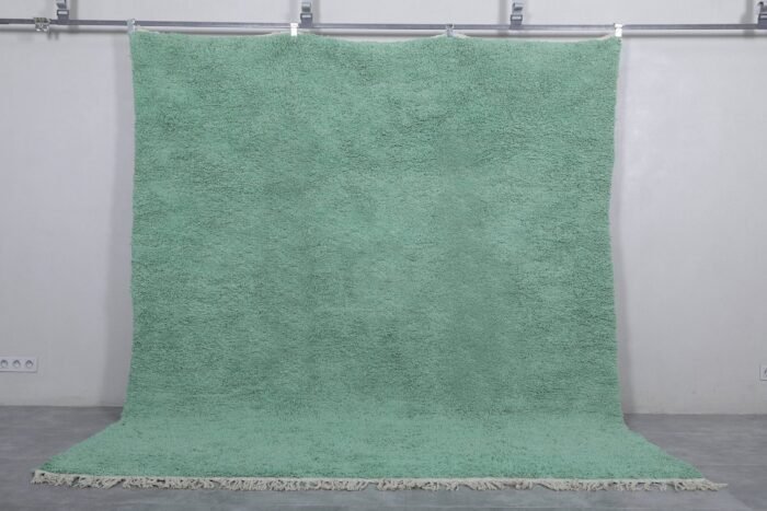 handmade mint green Moroccan rug, showing the fine wool texture and subtle color. Handwoven by Berber women, this rug adds calm and character to modern, minimalist, or Scandinavian-style rooms.