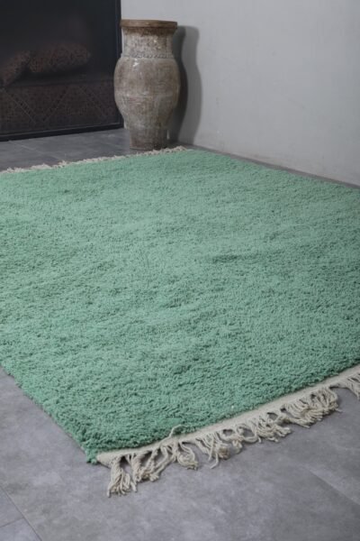 mint green Moroccan rug, showing the thick wool fibers and precise hand-knotting. A perfect example of traditional Berber artistry blended with soft pastel elegance.