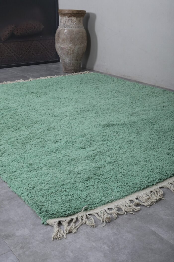 mint green Moroccan rug, showing the thick wool fibers and precise hand-knotting. A perfect example of traditional Berber artistry blended with soft pastel elegance.