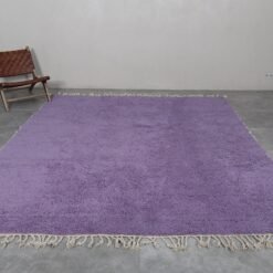 handmade Moroccan rug in vibrant iris purple. Solid color layout with optional fringes, perfect for boho, minimalist, or luxe interiors.