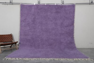 Handmade Moroccan Berber rug in rich iris purple color, crafted with 100% natural wool by Atlas Mountain artisans. This elegant Beni Ourain rug adds depth, warmth, and artistic flair to modern interiors. Ideal for stylish living rooms, bedrooms, or statement entryways.