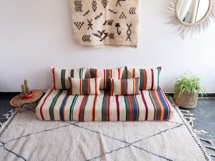 Artisan weaving colorful striped wool fabric for Moroccan cushions