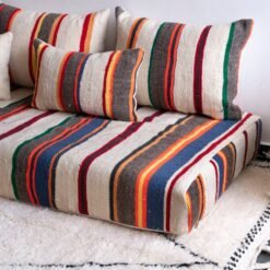 Stacked Moroccan cushion covers showing colorful striped embroidery