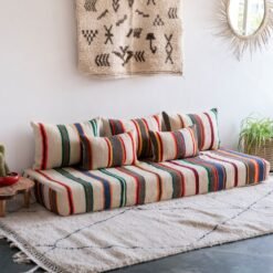 Boho living room with ivory lamb wool Moroccan floor sofa set featuring multicolor stripes